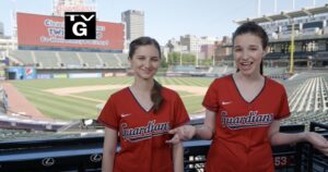 Hadley and Delaney stand in front of the baseball diamond in Cleveland.